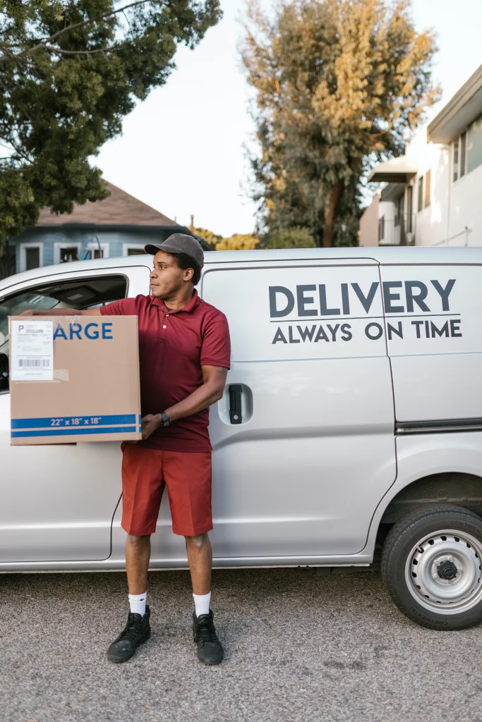 van delivery driver wearing a maroon uniform